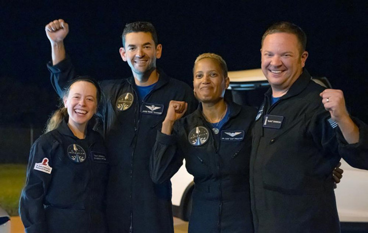 In this image released by Inspiration4, passengers aboard a SpaceX capsule, from left to right, Hayley Arceneaux, Jared Isaacman, Sian Proctor and Chris Sembroski pose after the capsule was r