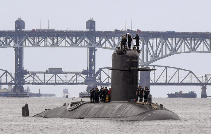In this photo provided by U.S. Navy, French submarine FNS Amethyste (S605) transits the Thames River in preparation to arrive at Naval Submarine Base New London in Groton, Connecticut, Sept. 