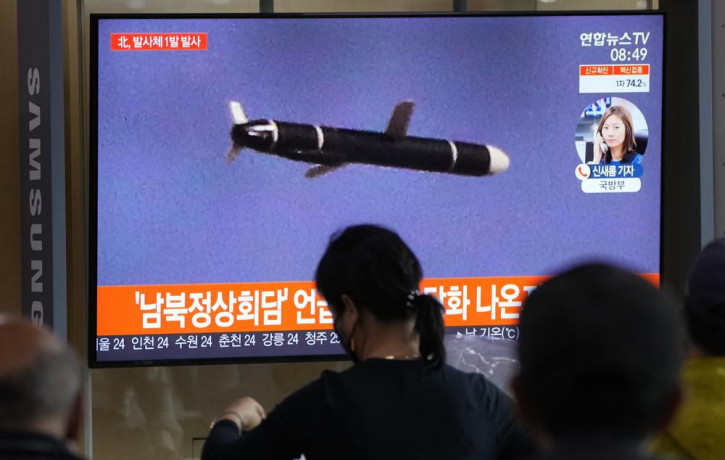People watch a TV showing a file image of North Korea's missile launch during a news program at the Seoul Railway Station in Seoul, South Korea, Tuesday, Sept. 28, 2021.