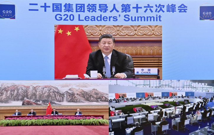 In this photo released by China's Xinhua News Agency, Chinese President Xi Jinping speaks via video link to leaders at the G20 Summit from Beijing, Sunday, Oct. 31, 2021.