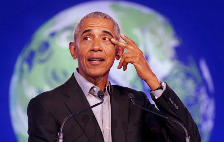 Former U.S. President Barack Obama gestures as he speaks during the COP26 U.N. Climate Summit in Glasgow, Scotland, Monday, Nov. 8, 2021.