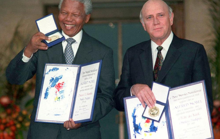 South African Deputy President F.W. de Klerk, right, and South African President Nelson Mandela pose with their Nobel Peace Prize Gold Medal and Diploma, in Oslo, Dec. 10, 1993.