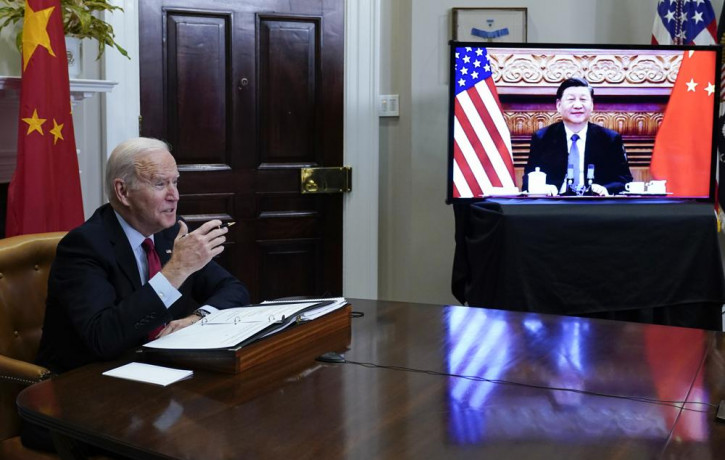US President Joe Biden meets virtually with Chinese President Xi Jinping from the Roosevelt Room of the White House in Washington, Monday, Nov. 15, 2021.
