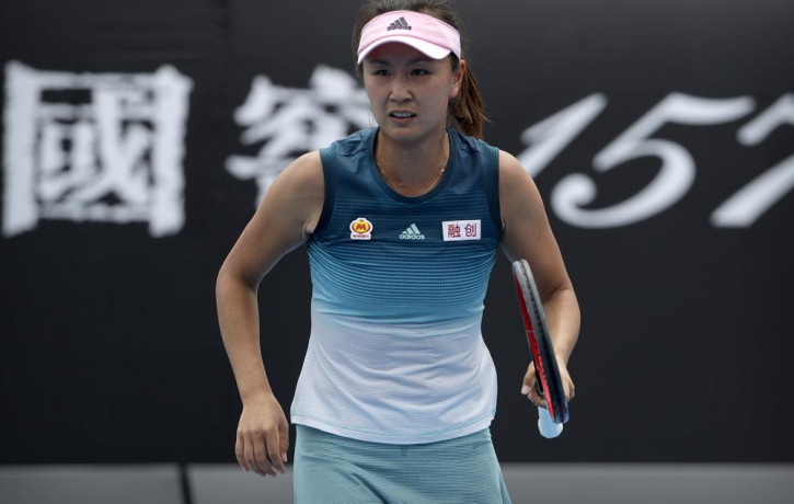 China's Peng Shuai reacts while competing against Canada's Eugenie Bouchard in their first round match at the Australian Open tennis championships in Melbourne, Australia, Tuesday, Jan. 15, 2