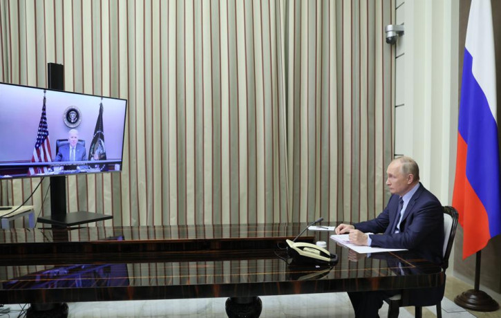 Russian President Vladimir Putin is shown during his talks with U.S. President Joe Biden via videoconference in the Bocharov Ruchei residence in the Black Sea resort of Sochi, Russia, Tuesday