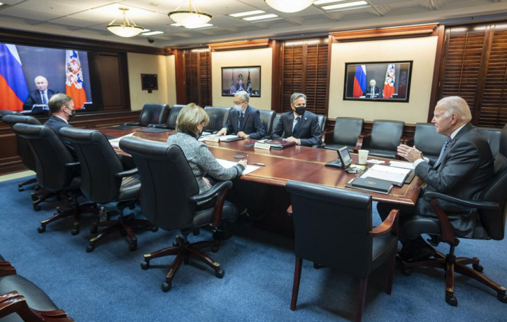 In this image provided by The White House, President Joe Biden speaks as he meets virtually via a secure video conference with Russian President Vladimir Putin from the Situation Room at the 