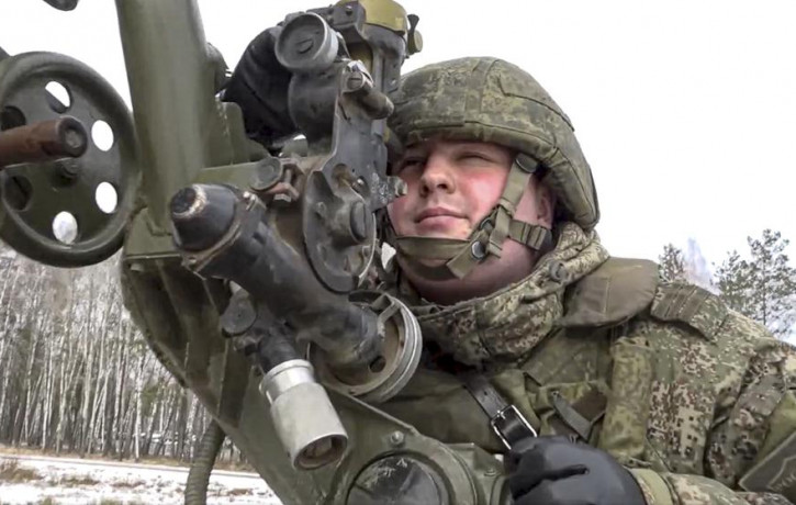 In this photo taken from video and released by the Russian Defense Ministry Press Service on Friday, Feb. 4, 2022, a soldier takes part in the Belarusian and Russian joint military drills at 