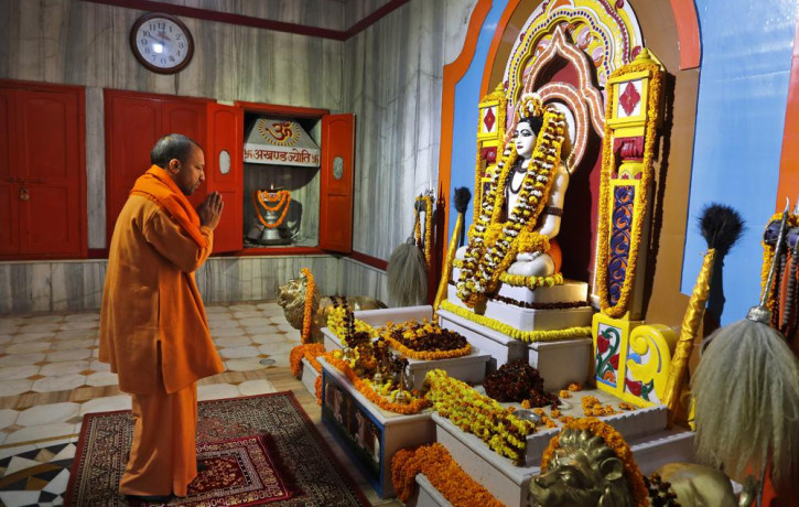 Uttar Pradesh Chief Minister Yogi Adityanath prays at a temple in the morning before going to file his nomination papers for the state assembly elections in Gorakhpur, India, Feb. 5, 2022.