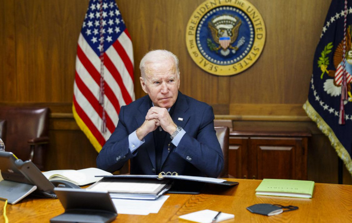 This image provided by The White House via Twitter shows President Joe Biden at Camp David, Md., Saturday, Feb. 12, 2022.