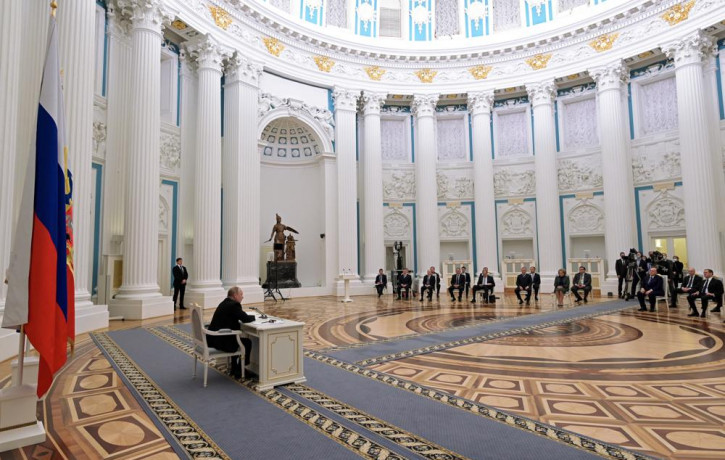 Russian President Vladimir Putin, left, chairs a Security Council meeting in the Kremlin in Moscow, Russia, Monday, Feb. 21, 2022.