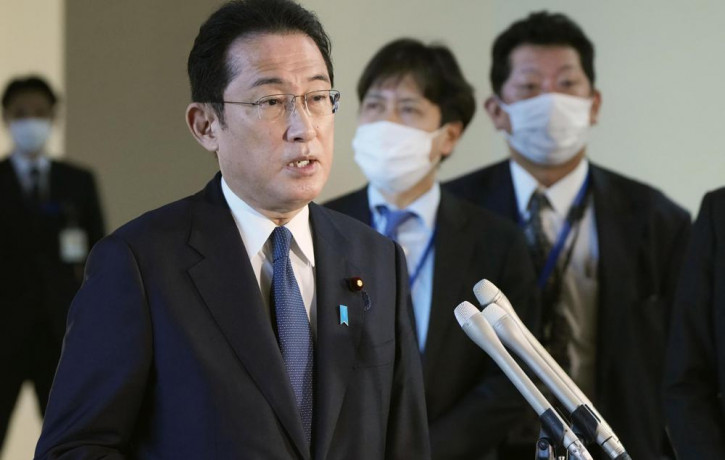 Japanese Prime Minister Fumio Kishida speaks to the reporters at the prime minister's official residence in Tokyo, Tuesday, Feb. 21, 2022.