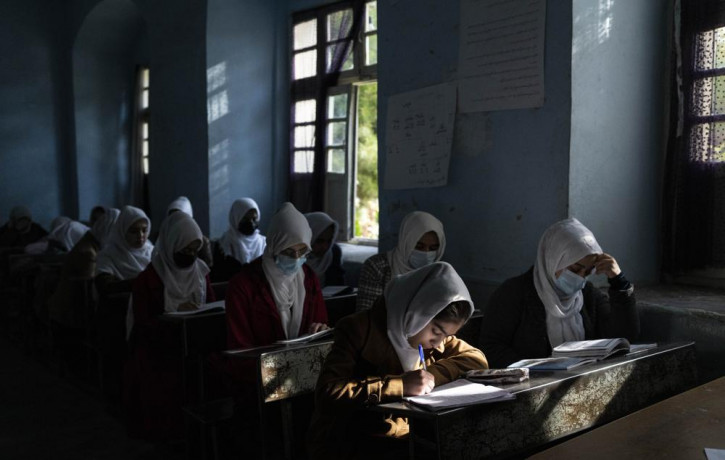 Afghan girls participate in a lesson at Tajrobawai Girls High School in Herat, Afghanistan on Nov. 25, 2021.