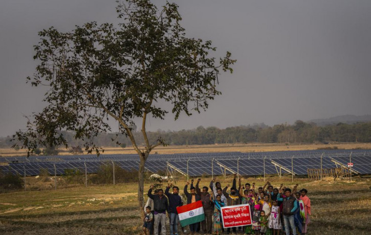 Farmers whose agriculture lands had been transfered to build a solar power plant protest near the plant in Mikir Bamuni village, Nagaon district, northeastern Assam state, India, Feb. 18, 202