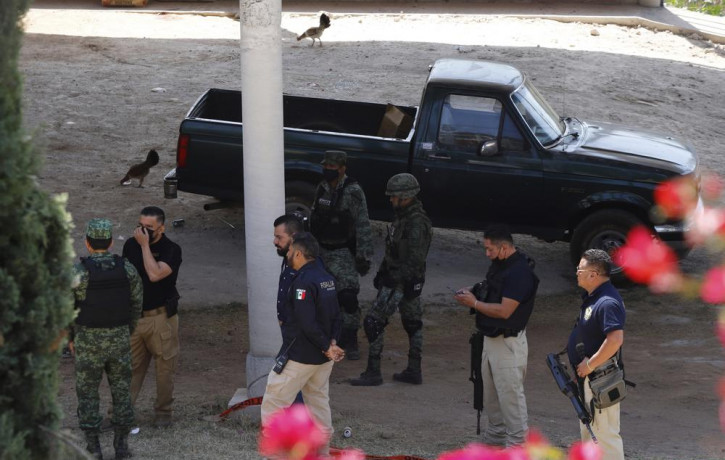 Army officers and Michoacan state prosecutors inspect the cockfighting site "El Paraiso," or Paradise in Zinapecuaro, Mexico, Monday, March 28, 2022.