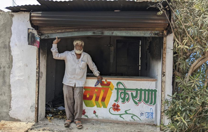 Nawab Khan stands by the entrance of his shop vandalized by a mob on April 10 in Khargone, in the central Indian state of Madhya Pradesh, Tuesday, April 12, 2022.