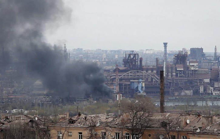 In this photo taken from video smoke rises from the Metallurgical Combine Azovstal in Mariupol, in territory under the government of the Donetsk People's Republic, eastern Ukraine, Tuesday, M
