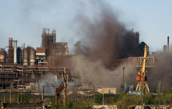 Smoke rises from the Metallurgical Combine Azovstal in Mariupol during shelling, in Mariupol, in territory under the government of the Donetsk People's Republic, eastern Ukraine, Saturday, Ma