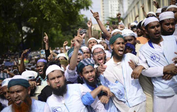 Muslims shout slogans against Nupur Sharma, a spokesperson of India's ruling BJP as they react to the derogatory references to Islam and the Prophet Muhammad made by her, during a protest out