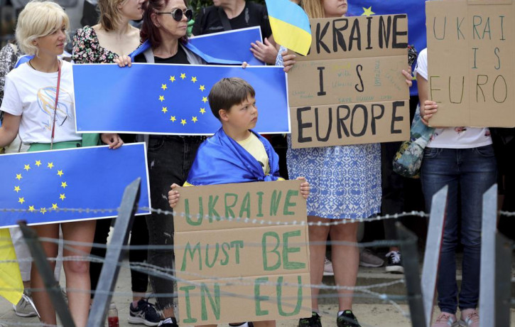 Protestors in support of Ukraine stand with signs and EU flags during a demonstration outside of an EU summit in Brussels, Thursday, June 23, 2022. AP/RSS Photo