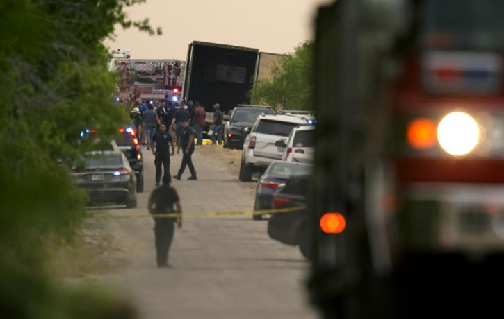 Body bags lie at the scene where a tractor trailer with multiple dead bodies was discovered, Monday, June 27, 2022, in San Antonio. AP/RSS Photo