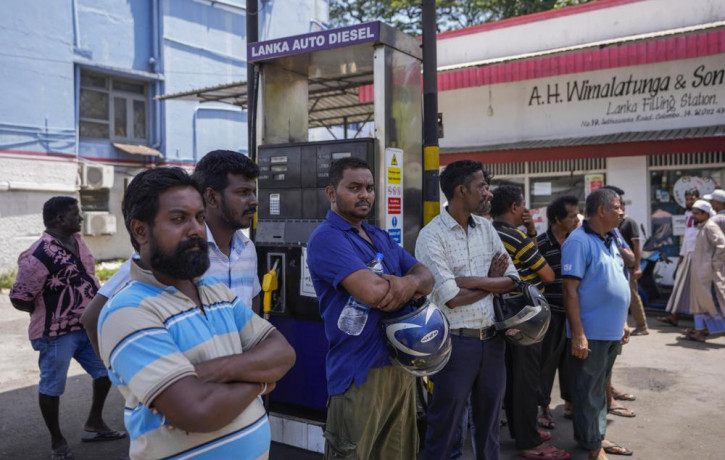 FILE- People wait to buy fuel at a fuel station in Colombo, Sri Lanka, June 27, 2022. AP/RSS Photo