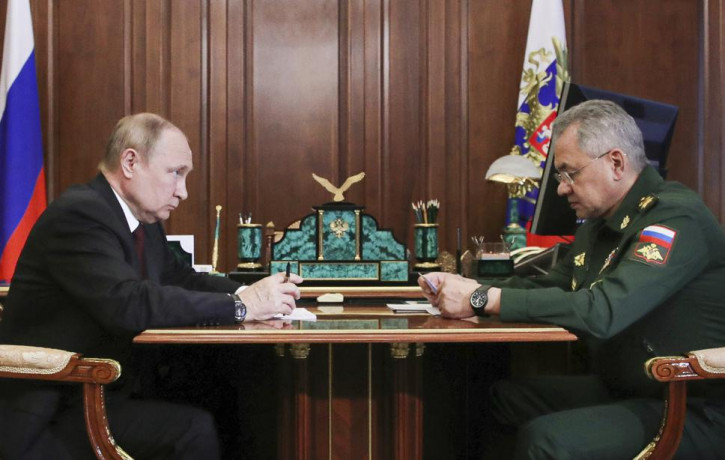 FILE - Russian President Vladimir Putin, left, listens to Russian Defense Minister Sergei Shoigu's report during their meeting in the Kremlin in Moscow, Russia, Monday, July 4, 2022. AP/RSS P