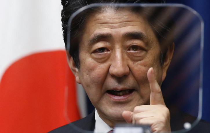 FILE - Japanese Prime Minister Shinzo Abe speaks during a press conference at his official residence in Tokyo on March 20, 2014. (AP Photo/RSS)