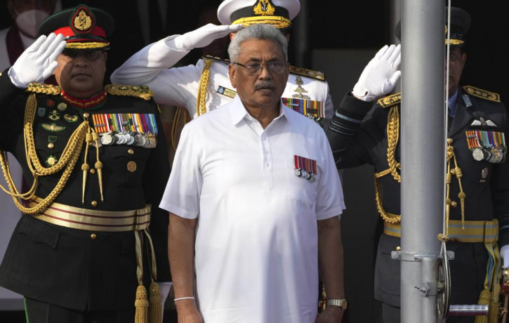 FILE- Sri Lankan President Gotabaya Rajapaksa sings the national anthem of Sri Lanka during the country's Independence Day celebration in Colombo, Sri Lanka, Feb. 4, 2022. AP/RSS Photo