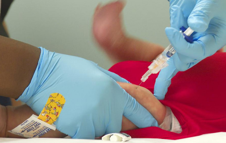 FILE - An infant receives a routine vaccination at First Georgia Physician Group Pediatrics in Fayetteville, Georgia, Aug. 17, 2021. AP/RSS Photo