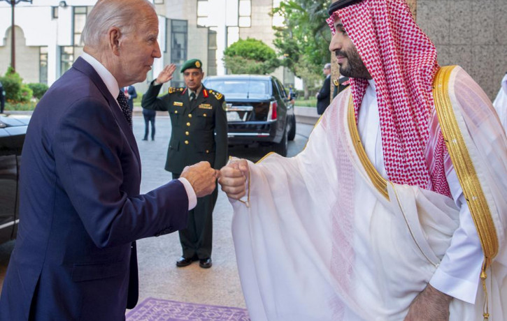 In this image released by the Saudi Royal Palace, Saudi Crown Prince Mohammed bin Salman, right, greets US President Joe Biden with a fist bump after his arrival at Al-Salam palace in Jeddah,