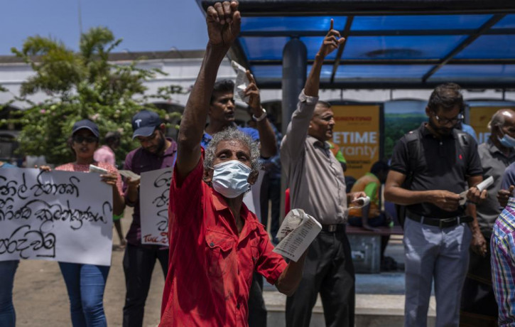 Trade union representatives and activists shout slogans during a protest against Sri Lanka’s acting president Ranil Wickremesinghe in Colombo, Sri Lanka, Monday, July 18, 2022.  AP/RSS Photo