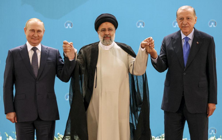 Russian President Vladimir Putin, left, Iranian President Ebrahim Raisi, center, and Turkish President Recep Tayyip Erdogan pose for a photo prior to their talks at the Saadabad palace, in Te