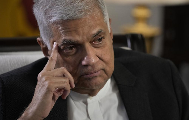 FILE - Sri Lanka's new Prime Minister Ranil Wickremesinghe gestures during an interview with The Associated Press in Colombo, Sri Lanka, Saturday, June 11, 2022. (AP Photo/RSS)