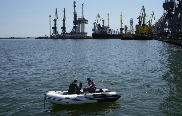 FILE - Servicemen of Donetsk People's Republic Emergency Ministry work to defuse a Ukrainian mine in an area of the Mariupol Sea Port, on April 29, 2022. AP/RSS Photo