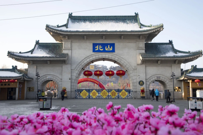 Tourists walk past a gateway with the name “Beishan” seen at the Beishan Park in northeastern China’s Jilin province on Jan 23, 2020. Four instructors from Iowa’s Cornell College teaching at Beihua University in northeastern China were attacked in the Beishan public park, reportedly with a knife, officials at the U.S. school and the State Department said Tuesday, June 11, 2024. AP/RSS Photo