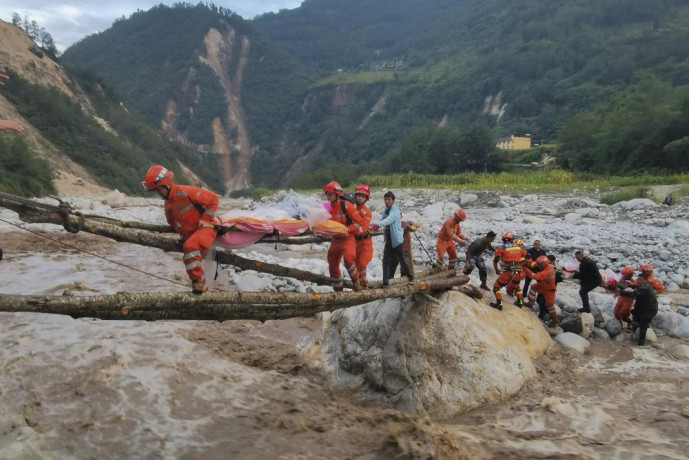 In this photo released by Xinhua News Agency, rescuers transfer survivors across a river following an earthquake in Moxi Town of Luding County, southwest China's Sichuan Province Monday, Sept. 5, 2022. AP/RSS Photo