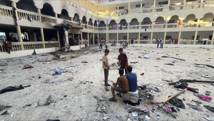 Palestinian health authorities say an Israeli airstrike hit a school-turned-shelter in Gaza City, killing more than 60 people.  AP/RSS Photo