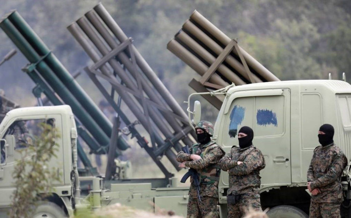 Hezbollah fighters stand in front of a missile battery. Hezbollah's August 25 attack on Israel used rockets with small warheads and limited range, meaning it was largely a symbolic gesture. Tasnim News Agency