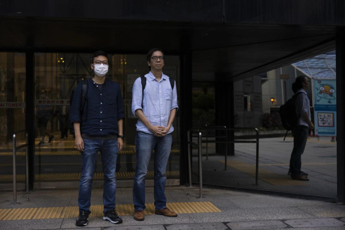 FILE - Former chief editor Chung Pui-kuen, right, and former acting editor Patrick Lam, left, of the now-defunct independent media outlet Stand News leave the court on the last day of the publication's sedition trial closing statements in Hong Kong, June 28, 2023. (AP Photo)