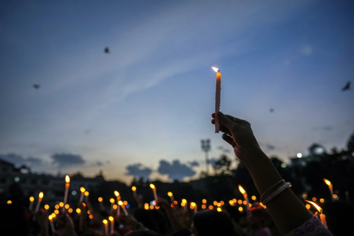 Women hold candles as they stage a protest against the rape and killing of a trainee doctor at a government hospital last week, in Guwahati, India, Friday, Aug. 16, 2024. AP/RSS Photo