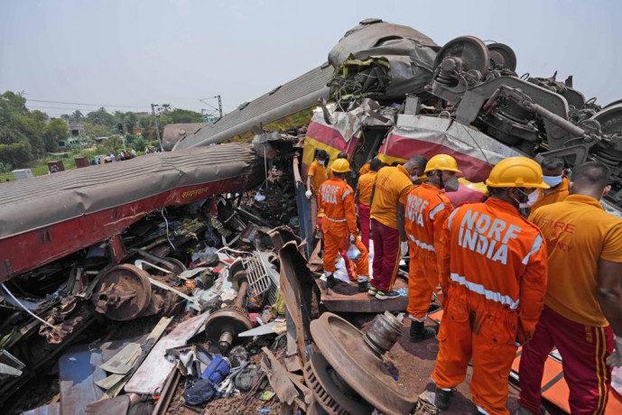 Rescuers work at the site of passenger trains that derailed in Balasore district, in the eastern Indian state of Orissa, Saturday, June 3, 2023.  AP/RSS Photo