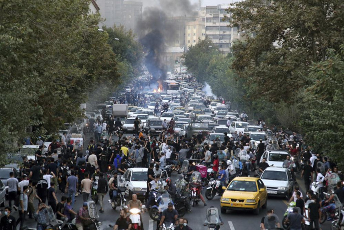 In this Wednesday, Sept. 21, 2022, photo taken by an individual not employed by the Associated Press and obtained by the AP outside Iran, protesters chant slogans during a protest over the death of a woman who was detained by the morality police, in downtown Tehran, Iran. AP/RSS Photo