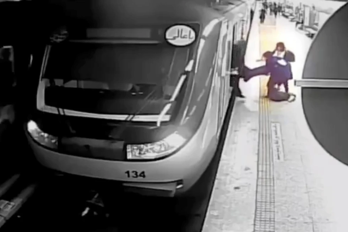 FILE - In this image from surveillance video aired by Iranian state television, women pull 16-year-old Armita Geravand from a train car on the Tehran Metro in Tehran, Iran, Sunday, Oct. 1, 2023. The Iranian teenage girl injured weeks ago in a mysterious incident on Tehran’s Metro while not wearing a head scarf has died, Iranian state media reported Saturday, Oct. 28. AP/RSS Photo