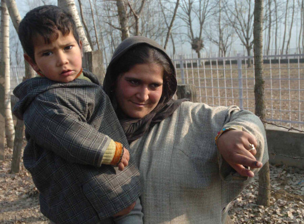 Kashmir's parties are unable to come together but the people are eager to vote as this woman, showing the mark on finger after casting her vote at a polling booth, did at a previous election