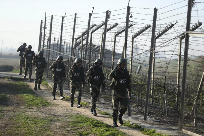 FILE- Indian Border Security Force (BSF) soldiers patrol near the India-Pakistan border fencing at Suchet Garh in Ranbir Singh Pura, Jammu and Kashmir, India, Jan. 23, 2020. AP/RSS Photo
