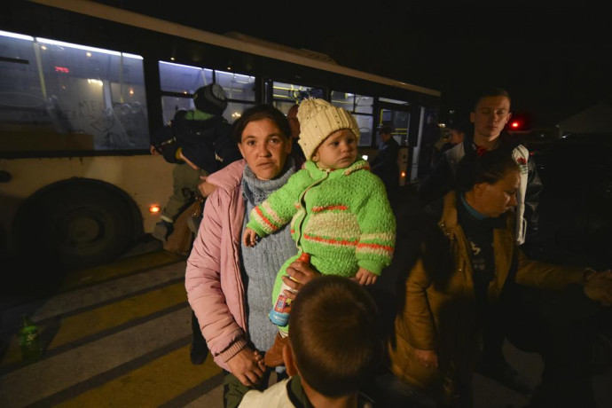 Evacuees from Kherson walk from a bus upon their arrival to Dzhankoi, Crimea, Thursday, Nov. 10, 2022. AP/RSS Photo