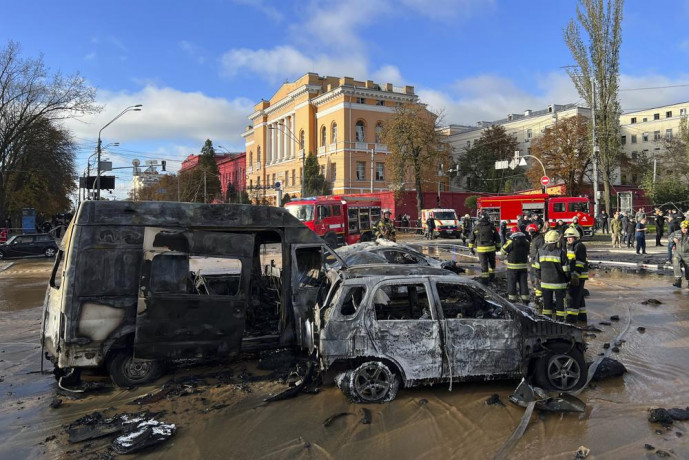 Rescue workers survey the scene of a Russian attack on Kyiv, Ukraine on Monday, Oct 10, 2022. (AP/RSS Photo)