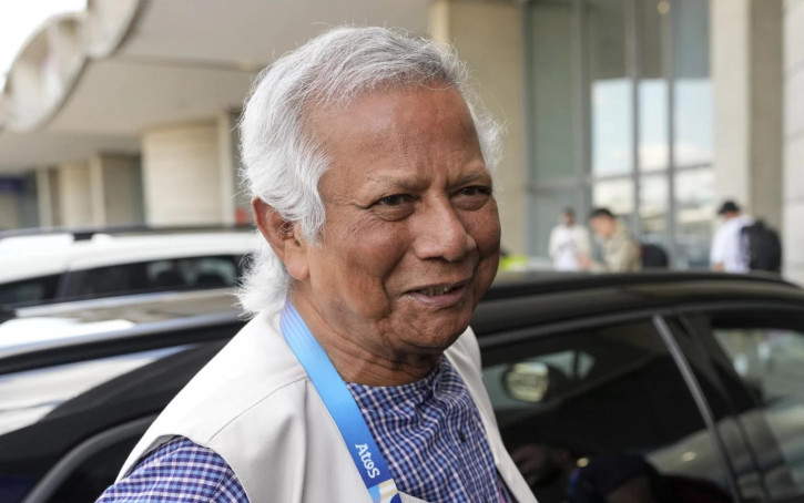 Nobel laureate Muhammad Yunus smiles upon his arrival at Charles de Gaulle's airport in Roissy, north of Paris, Wednesday, Aug. 7, 2024. (AP Photo)