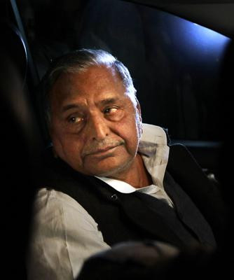 FILE- Samajvadi Party leader Mulayum Singh Yadav leaves the parliament in his car in New Delhi, India, Dec 5, 2012. (AP/RSS Photo)