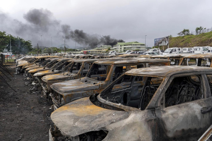 FILE - Burnt cars are lined up after unrest in Noumea, New Caledonia, on May 15, 2024. (AP Photo)